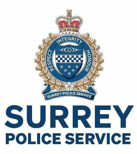 Emblem of Surrey Police Service featuring a crowned badge with symbols of integrity and honour.