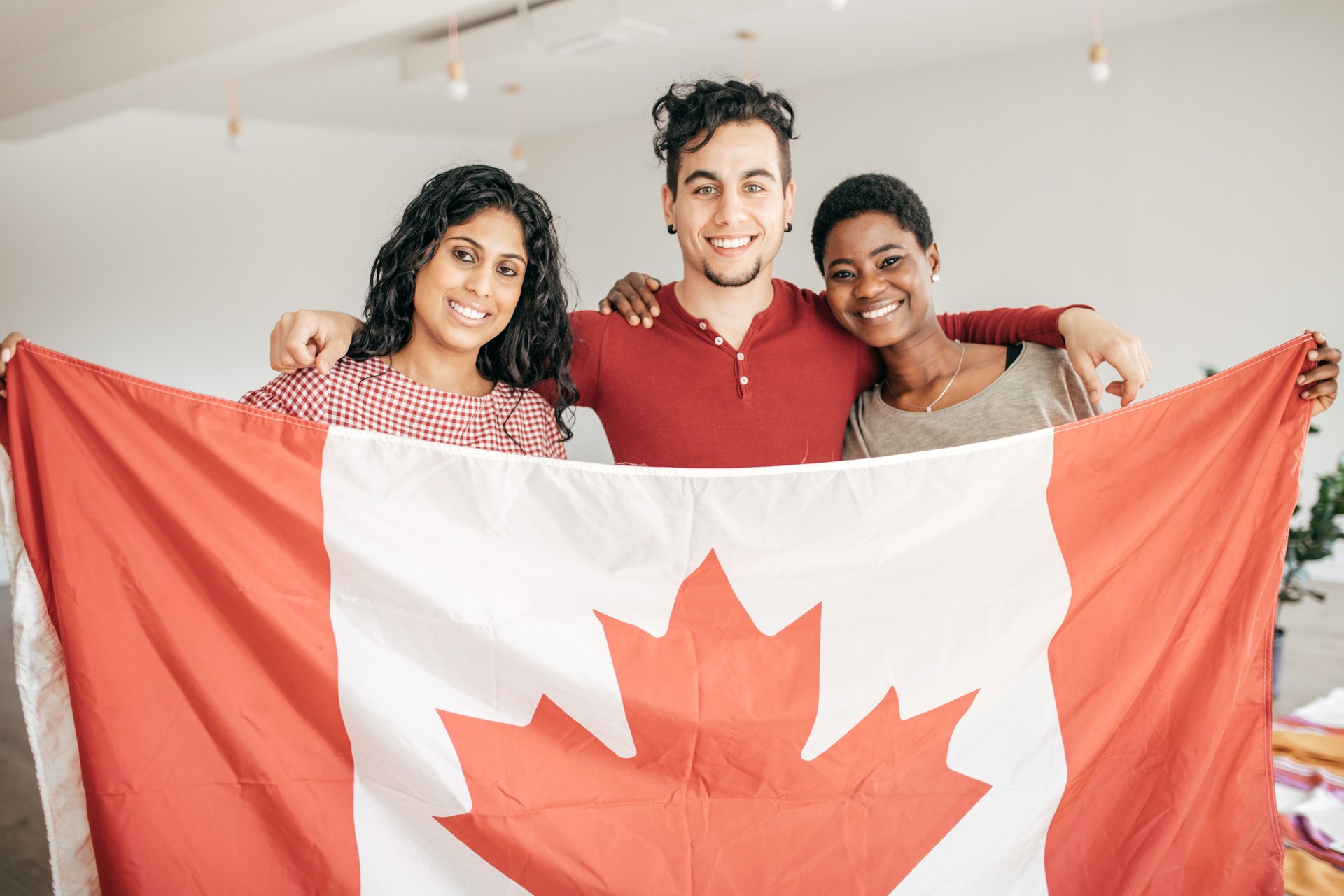 Students holding Canadian flag